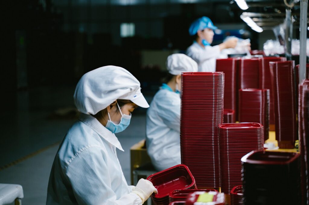 Worker at a factory in China where thousands of American jobs are moving to.