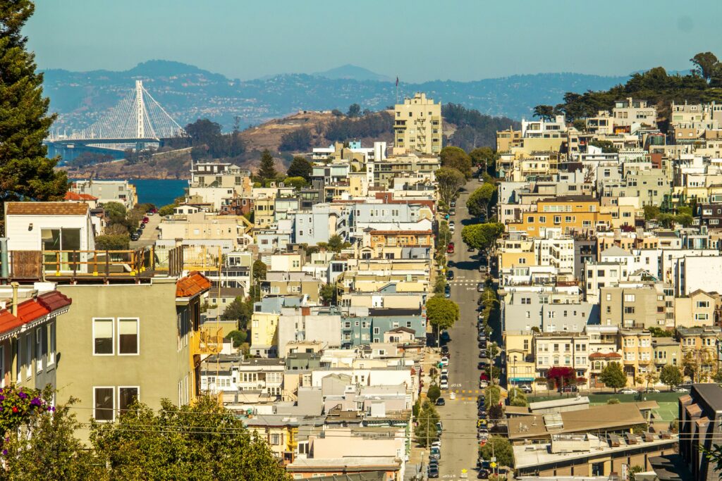 A vibrant view of San Francisco's urban landscape with the Bay Bridge in the background.