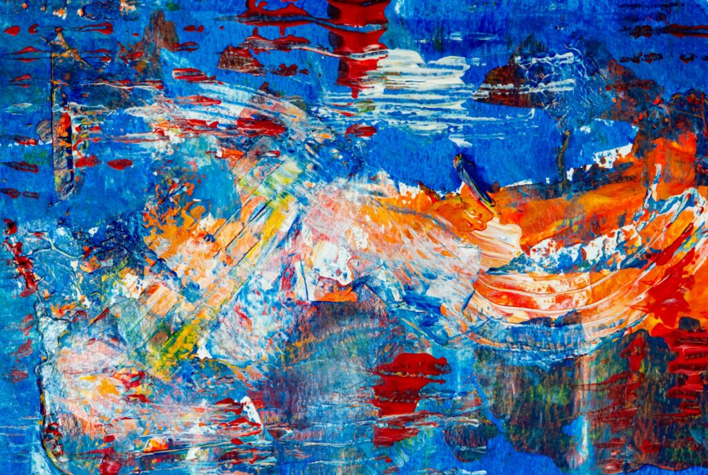 Dynamic abstract artwork featuring bold blue, orange, and red hues in acrylic paint.