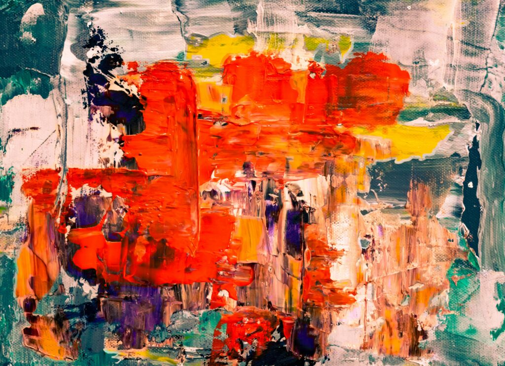 Dynamic abstract art with vibrant colors and bold brush strokes on canvas.